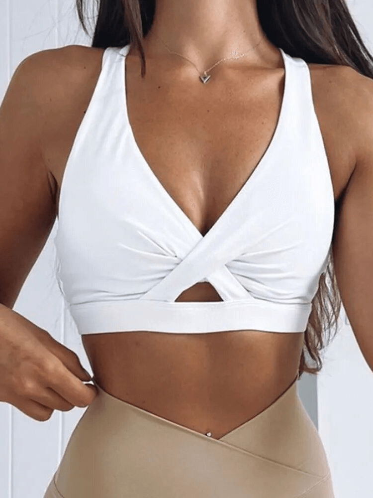 Woman wearing stylish breathable sports bra with woven front design, perfect for yoga and running.
